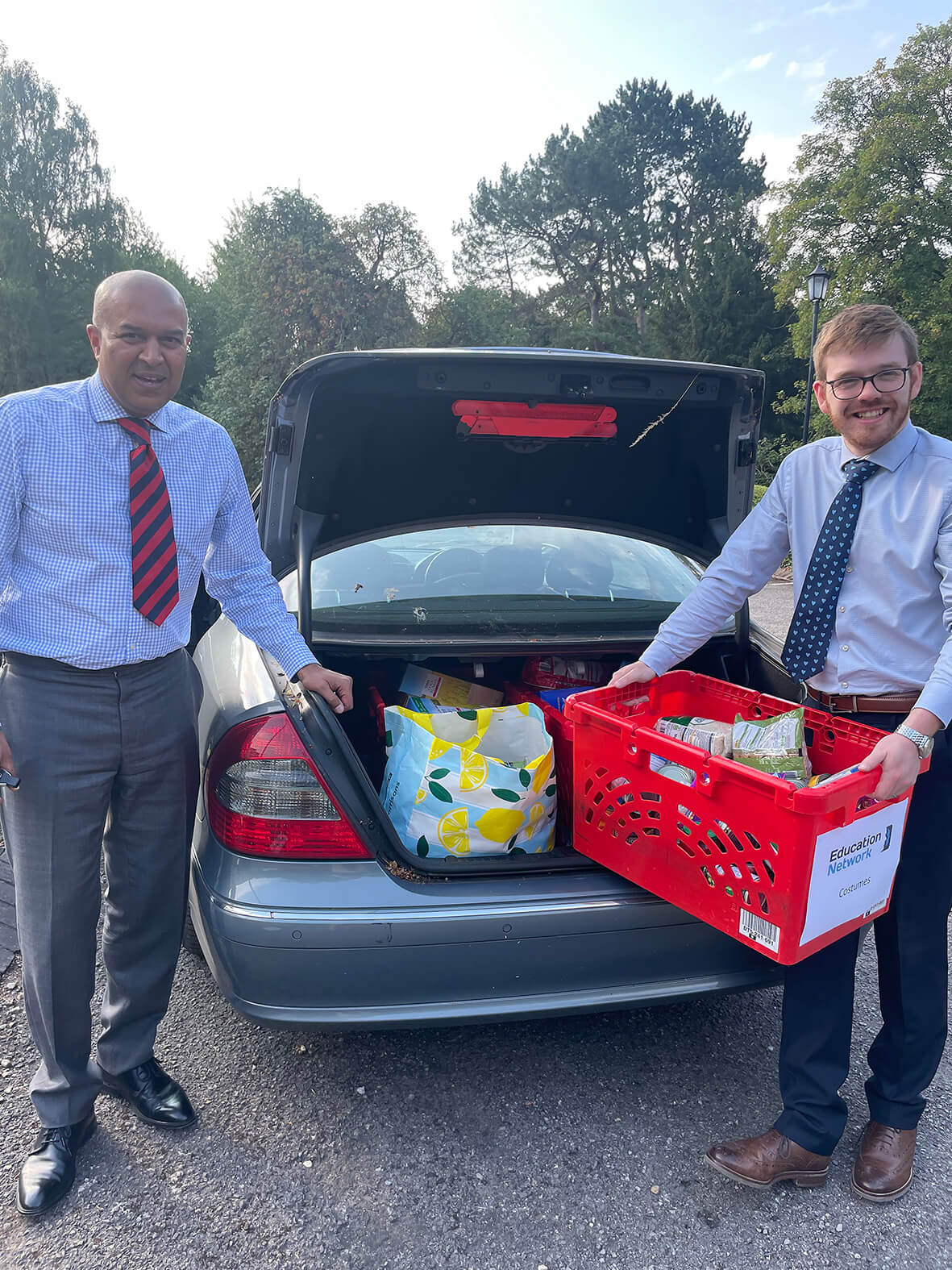 Manny and Harry giving food hampers to families during the school holidays 